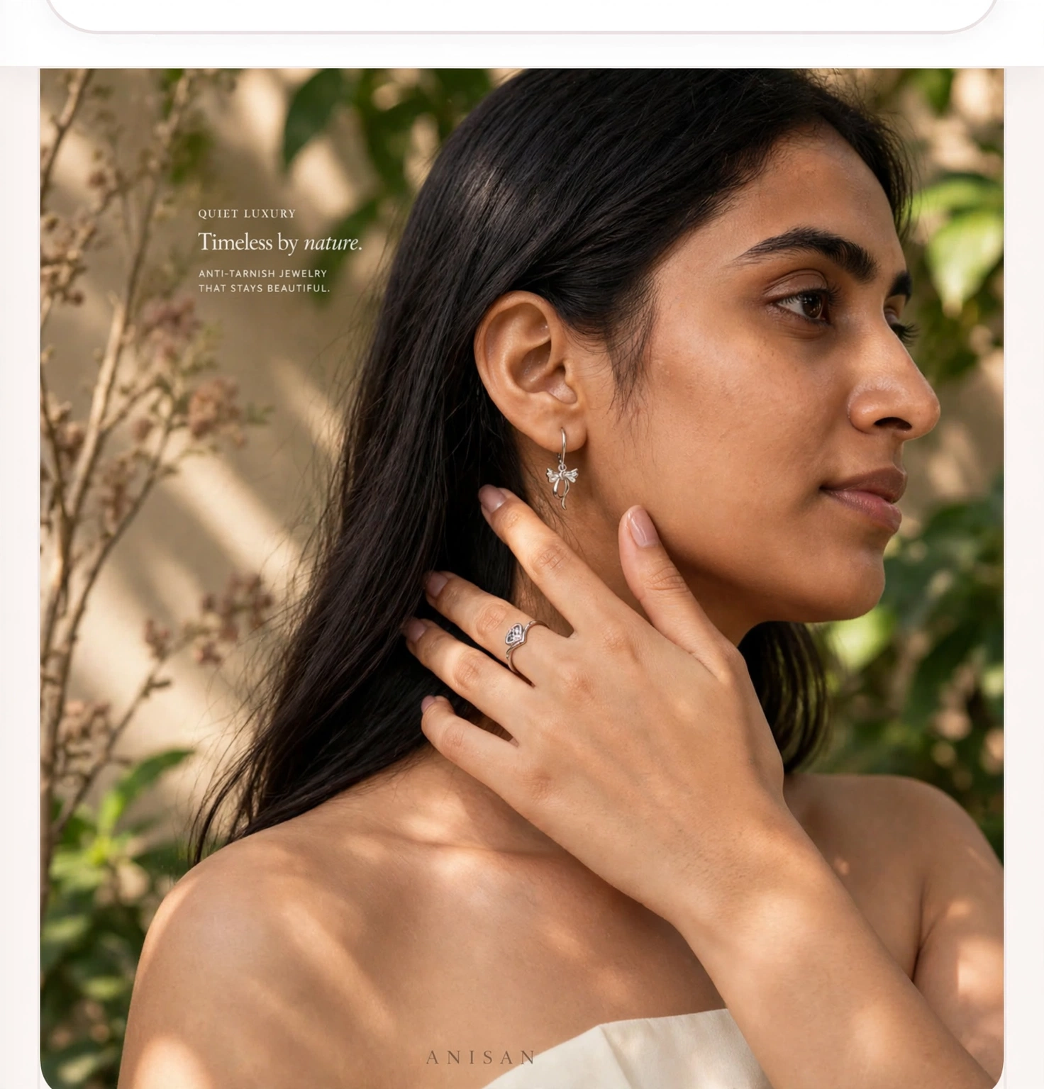 Quiet luxury — model wearing Anisan bow earring and heart ring, anti-tarnish jewellery